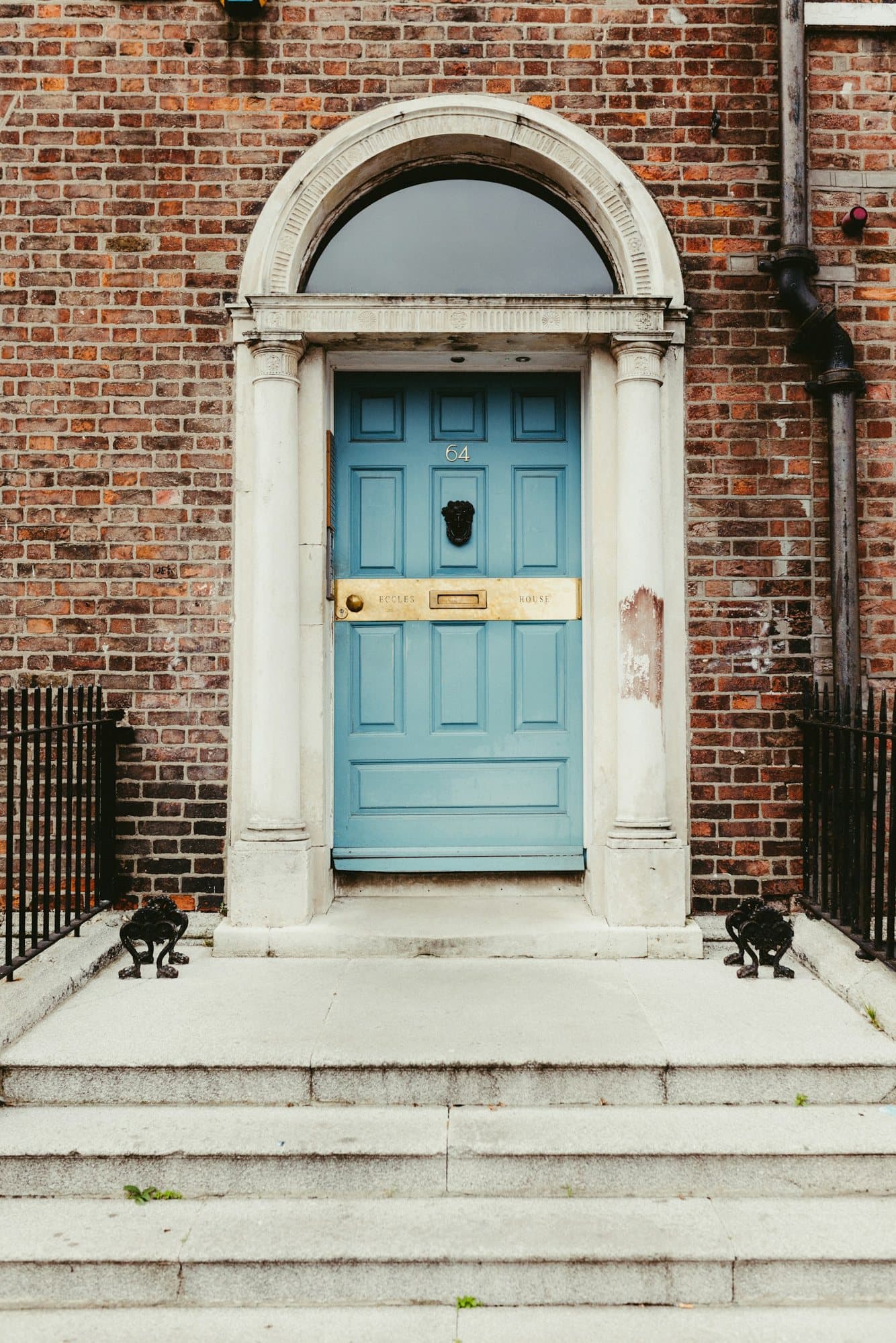 A blue Georgian door with a fanlight